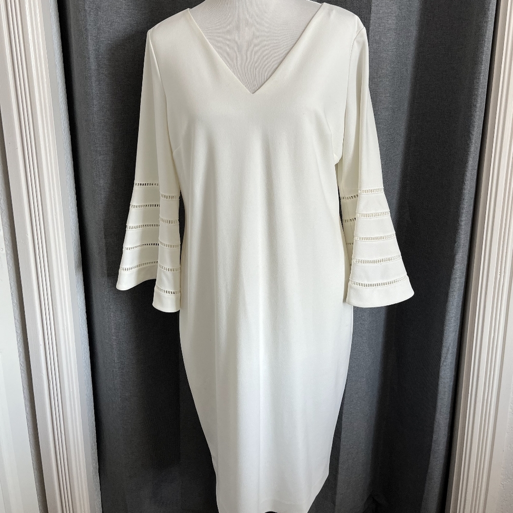 White Calvin Klein sheath dress. Lined, back zip, bell sleeve. 16